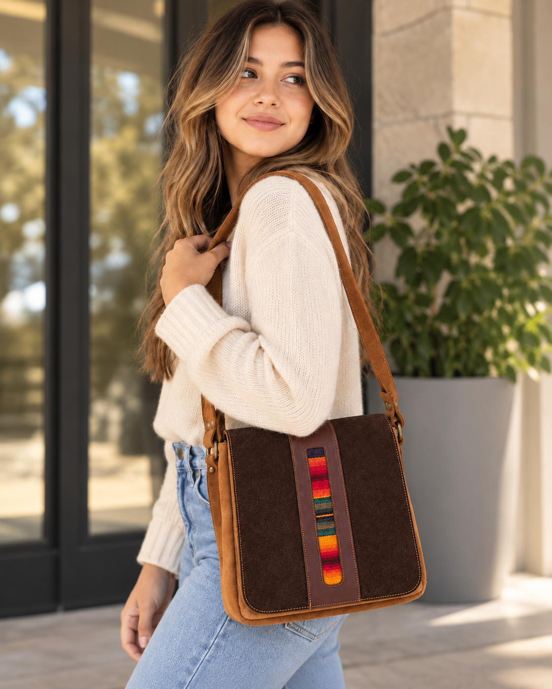 Model carrying a brown Marina Fashion handbag